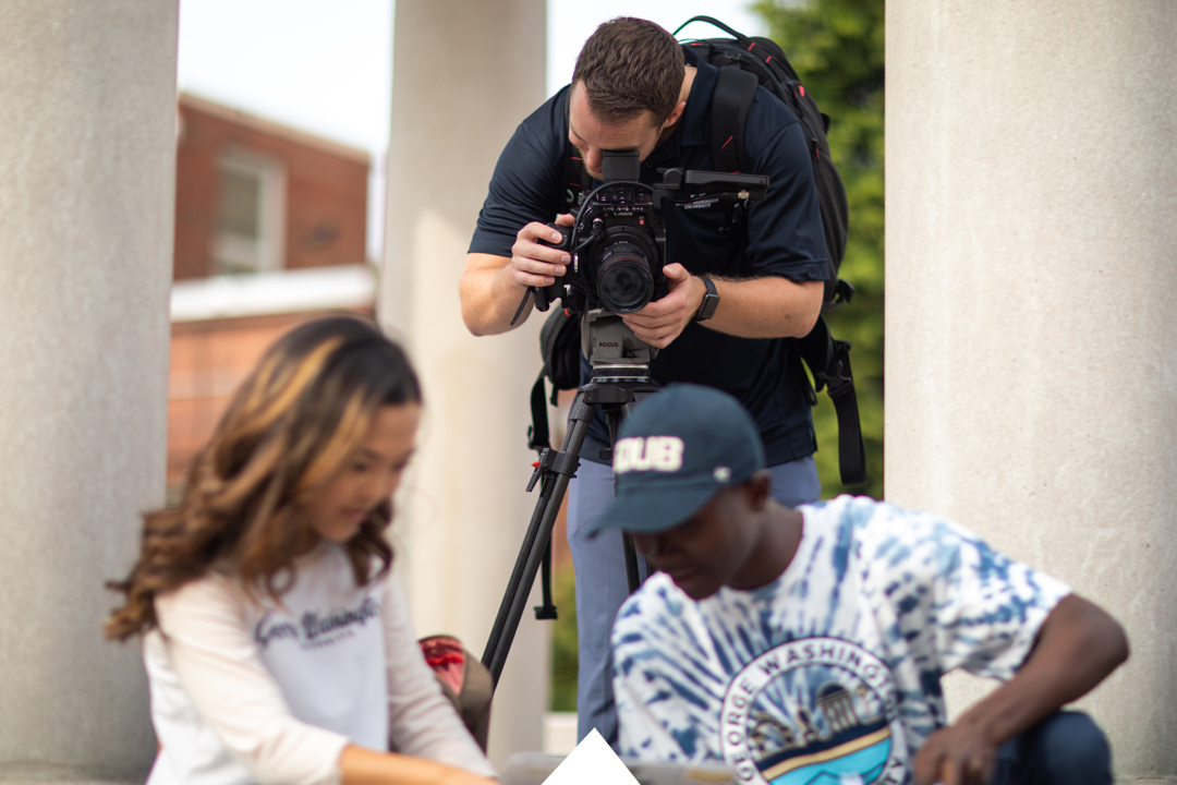 Videographer filming two students at the Tempietto